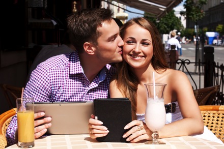 Young affluent couple at cafe