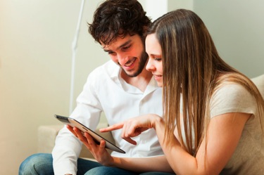 Couple shopping on tablet