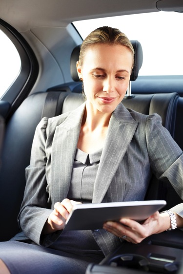 Executive woman tablet car