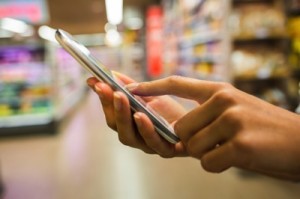 Mobile commerce is here to stay: Customer shopping in-store on phone