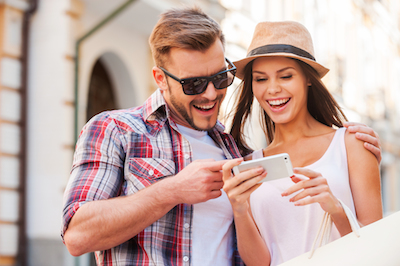 Young couple using e-commerce on mobile