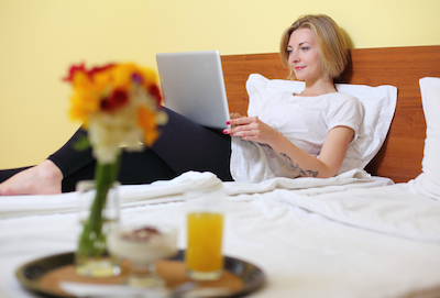 Leveraging Your Existing Guests to Drive Direct Business: Guest lying in bed
