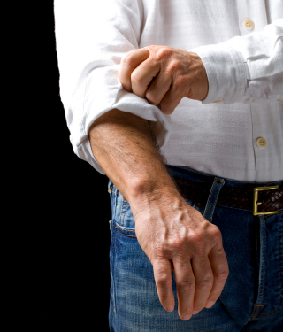 The plan is not the goal: Man rolling up sleeves to get to work