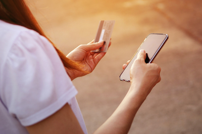 Necessary insights into mobile commerce: Woman shopping on phone