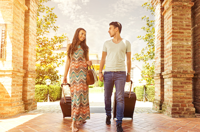 8 Extraordinary Insights into Hospitality Marketing and Distribution: Image of couple checking into hotel
