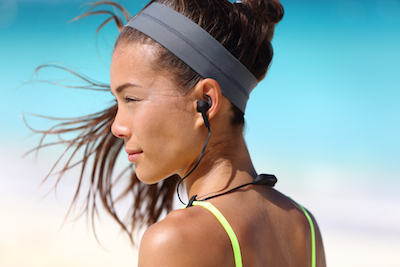 Mobile is a situation: Woman interacting with smart headphones