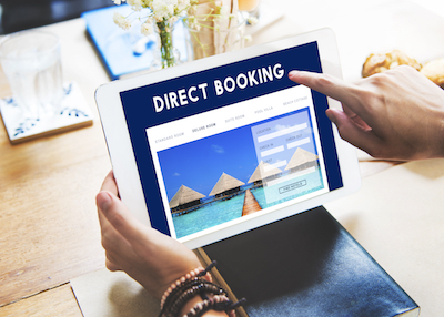 Trends Driving Hotel Digital Marketing: Guest shopping on tablet for hotel direct booking