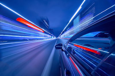 Speed: The single biggest change to business - fast-moving car driving towards the future