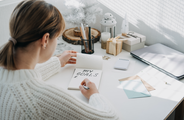 Woman writing lessons using STAR framework to succeed next year