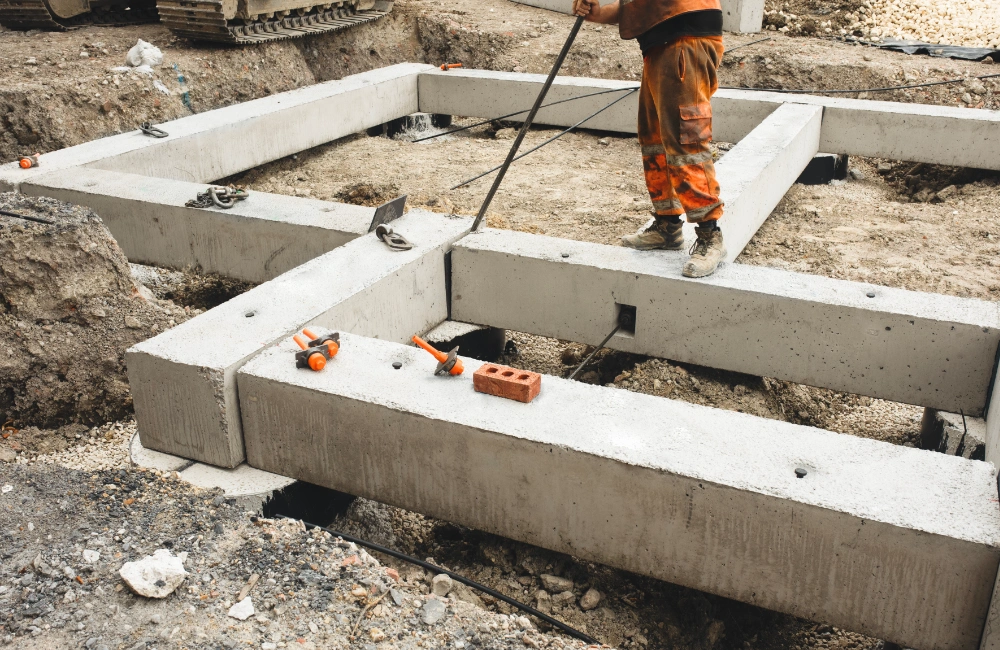 Construction worker building a foundation as a metaphor for why the long game matters for AI strategy success