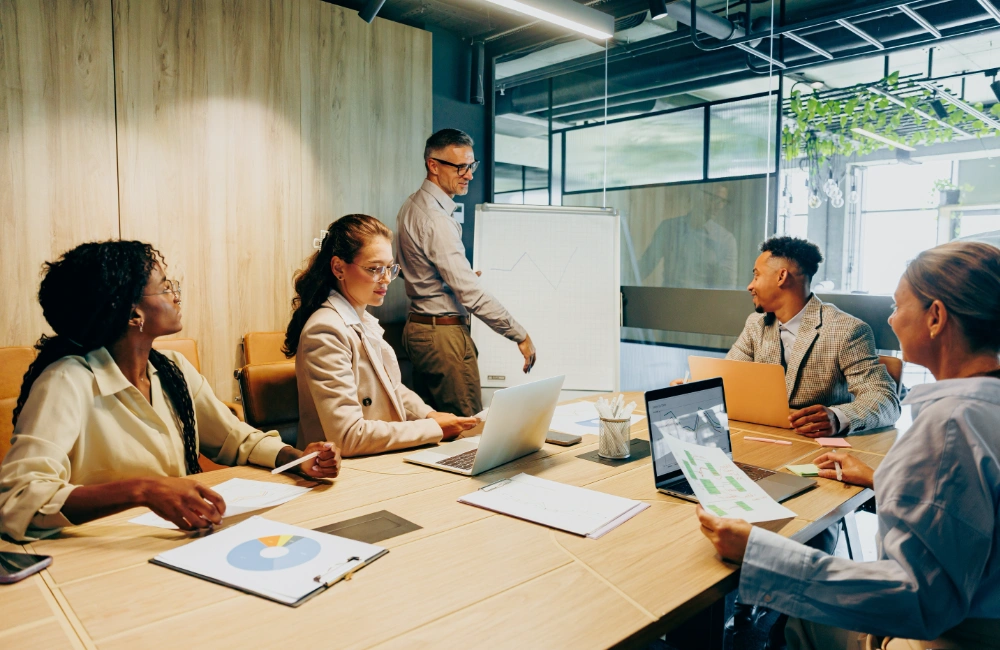 Business meeting with diverse professionals to illustrate the idea of a complete roadmap for owning your customer
