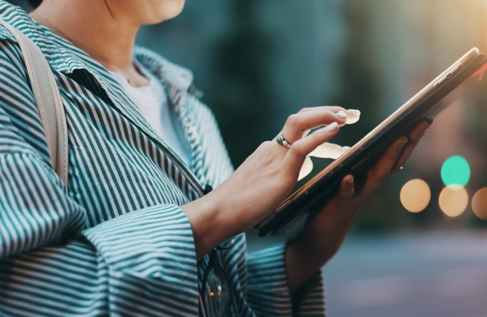 Woman clicking link in tablet to illustrate that clicks are overrated